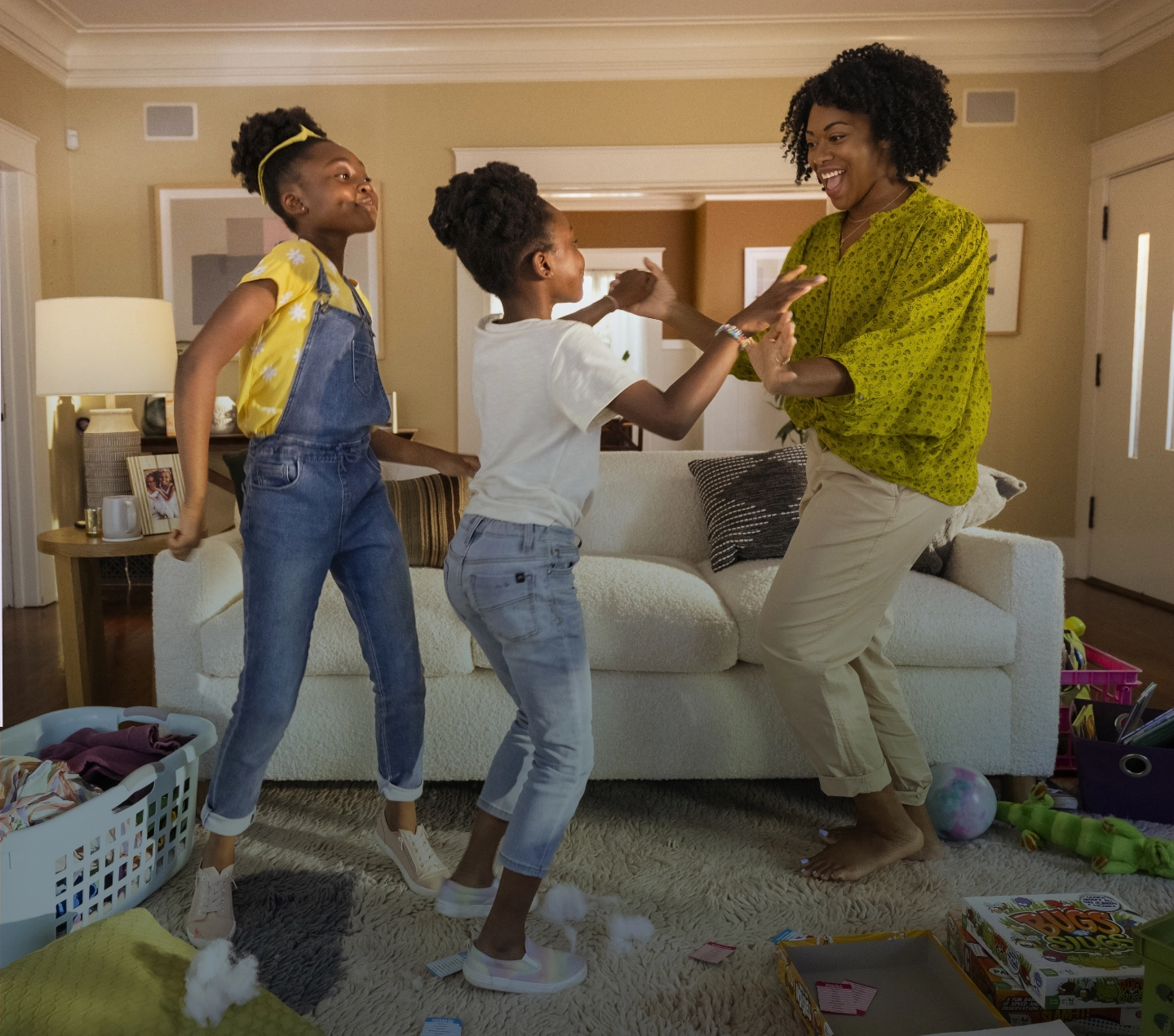 Two-panelled actor portrayal of a woman at home, first on the couch and then the same woman dancing with her kids.