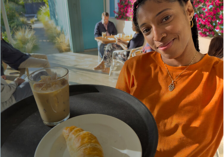 Actor portrayal of a woman happily serving drinks at a café who wants days like this to be a bigger part of her life